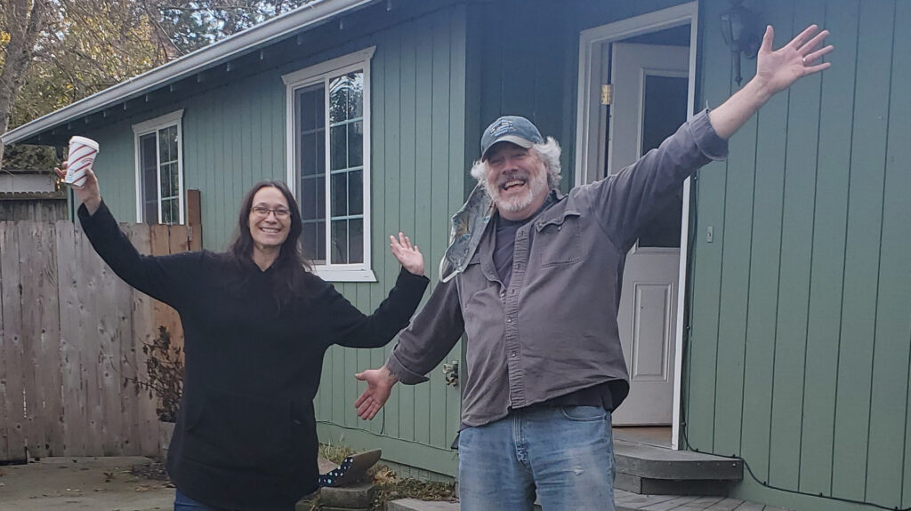 Sarah in front of new home